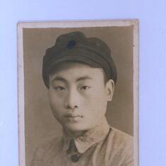 Dad circa 1942.  He was close to graduation from High School, so he walked to Chongqing to have his portrait taken.