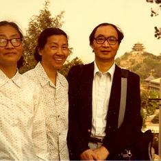 With two younger sisters, on early return trip to China