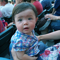 P1017501  Kaya sitting on her mom's knee at MN TWINS BB game; 4th of July.