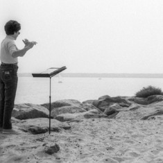 Laila air-fluting on the beach - 1970