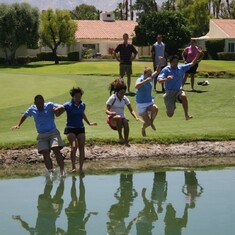 Larry jumping into Poppie's Pond at Missions Hills CC