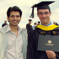 Micho graduating with his master's degree in Electrical Engineering at 21, with good friend and long time lab-mate Pavan.
