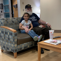 Great granddaughter sitting with him before doctor appointment 