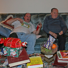 Dad and Mike on couch with candy