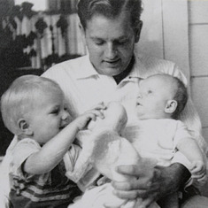 Dad holding Greg and Bill