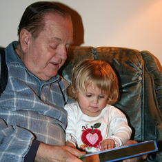 Dad reading to Josie at Christmas