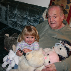 Dad with Josie and stuffed animals