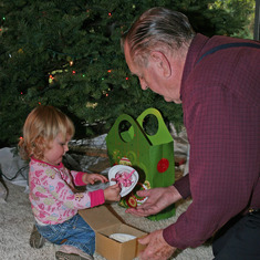 Dad with Josie by Christmas tree