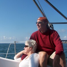 Sailing San Diego Harbor 2007 with his Wife, Sherrie Fisher.  His oldest son, Michael is at the helm.