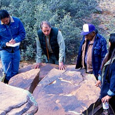 Larry with Hualapais at vandalized petroglyph site, spring 1993. 