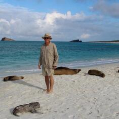 With sea lions on Hood Island, the Galapagos, 2014