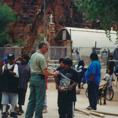 Larry teaching Havasupai children how to throw atlatls at Earth Day 1999. 