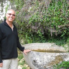 June 2011, outside the ancient cave site Grotte du Sorcerer near Les Eyzes, France. Larry used this picture on his media profile.