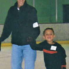 Laura teaching Peyton Gifford, Russ and Kathleen's grandson, to skate at the McCall 2002.