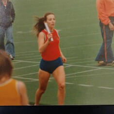 Laura in 3rd leg of Mile Relay 1979 as BSU Bronco grit gets the baton to her anchor.