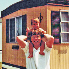 At the beach: Laura on Dad's shoulders (1982)