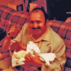 Great-Uncle Ted Hill holds newborn Laura