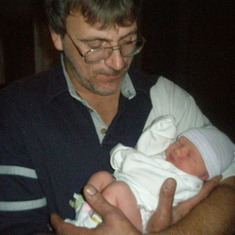 mark{larry's son} holding his granddaughter kylee..
