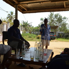 Dad carrying on a conversation with Kingsley and his boyz the day after his traditional wedding in Kumba.