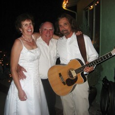 bride and groom with good friend, Mark Romano
