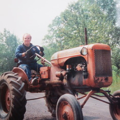 Larry on a tractor in Michigan
