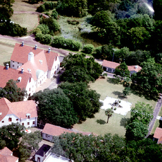 Aerial view of the Marine Institute on Sapelo Island, August 1976. Main Lab building on the left, apartments for guest researchers on the right, offices and utility buildings on other sides.