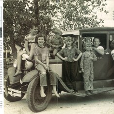Lawrence, left on hood - Model A Ford Kole children