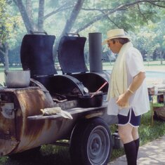 Lawrence BBQ-ing in his 70s shorts.