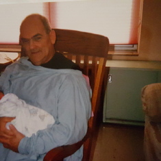 Dad holding Chris for the first time 1998