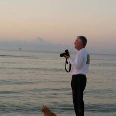 A man, his cat and his camera, waiting for the perfect shot.