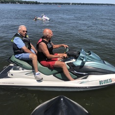 Leland and buddy John VanderMeer taking a spin on Lake Macatawa (MI) (2019). Sneakers on the water?