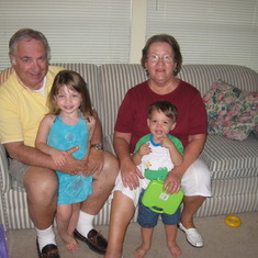 Some of his greatest joys -- his grandkids (all 9 of them). Here with Emily & Ian.