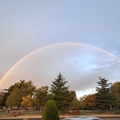 A full rainbow in front of the house 