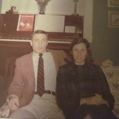 Bucky and Caroljane sitting on the couch in the living room at 181 Ferndale Rd.