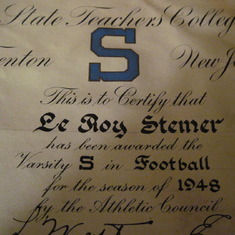 A letter of recognition for his accomplishment in football at Trenton State Teacher's College.