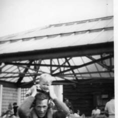 a seat on dad's shoulders