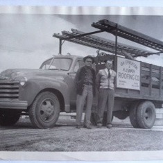 Oscar Erickson and his partner in front of their work truck, used for their roofing company in Brookings, after WWII was over.