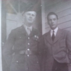 Army man Thurman with Lester on the front porch before he ships out to the Pacific.