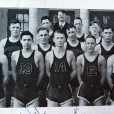Brookings High School Basketball Team 1936. Les is front row, 2nd from right, # 12 tank shirt.