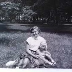 Linette and cousin Carol, cuddling on a summer day in the park. What a sweety little Carol is!