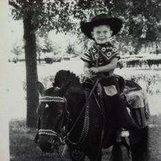 Little Larry Wayne, Lola's son, on his birthday. A little cowboy on a pony.