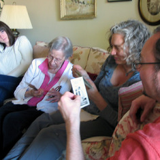 Camille, Ma, Rhoda and Ben looking at pics