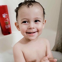 Baby Ronnie he loves his baths he has a great smile we miss you mom love you so much.