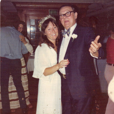 Mom and her Father at her wedding.
