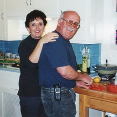 Linda with Eldon doing what he does best! She loved when others would cook for her...