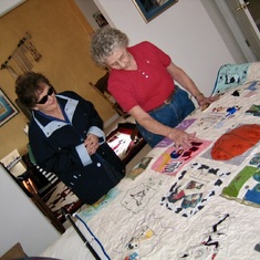 Linda & Martha looking over the Quilt she made for McCauley's Bat Mitzvah