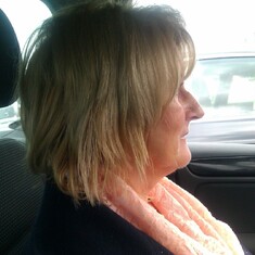 Linda in one of her many scarfs, passenger in our car and picture taken by me, Tony.