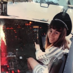 Lisa in the cockpit on the plane taking us to Disney World thanks to make a wish.