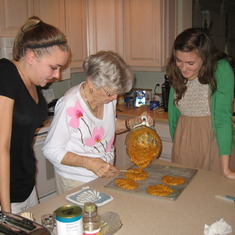Grandma teaching Kaley and Sarah how to make her peanut brittle