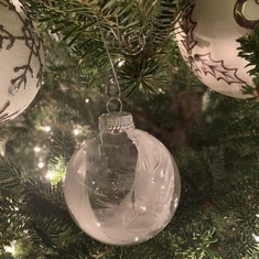In honor of YOU MOM. A white feather ornament 